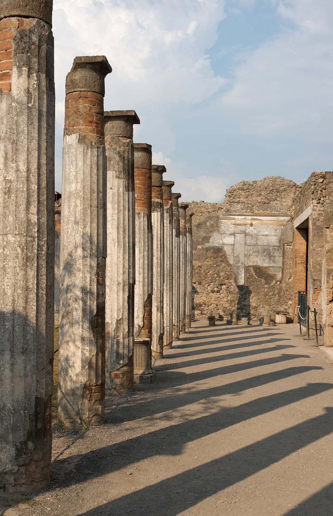 A row of columns and their shadows in the House of the Faun at Pompeii.